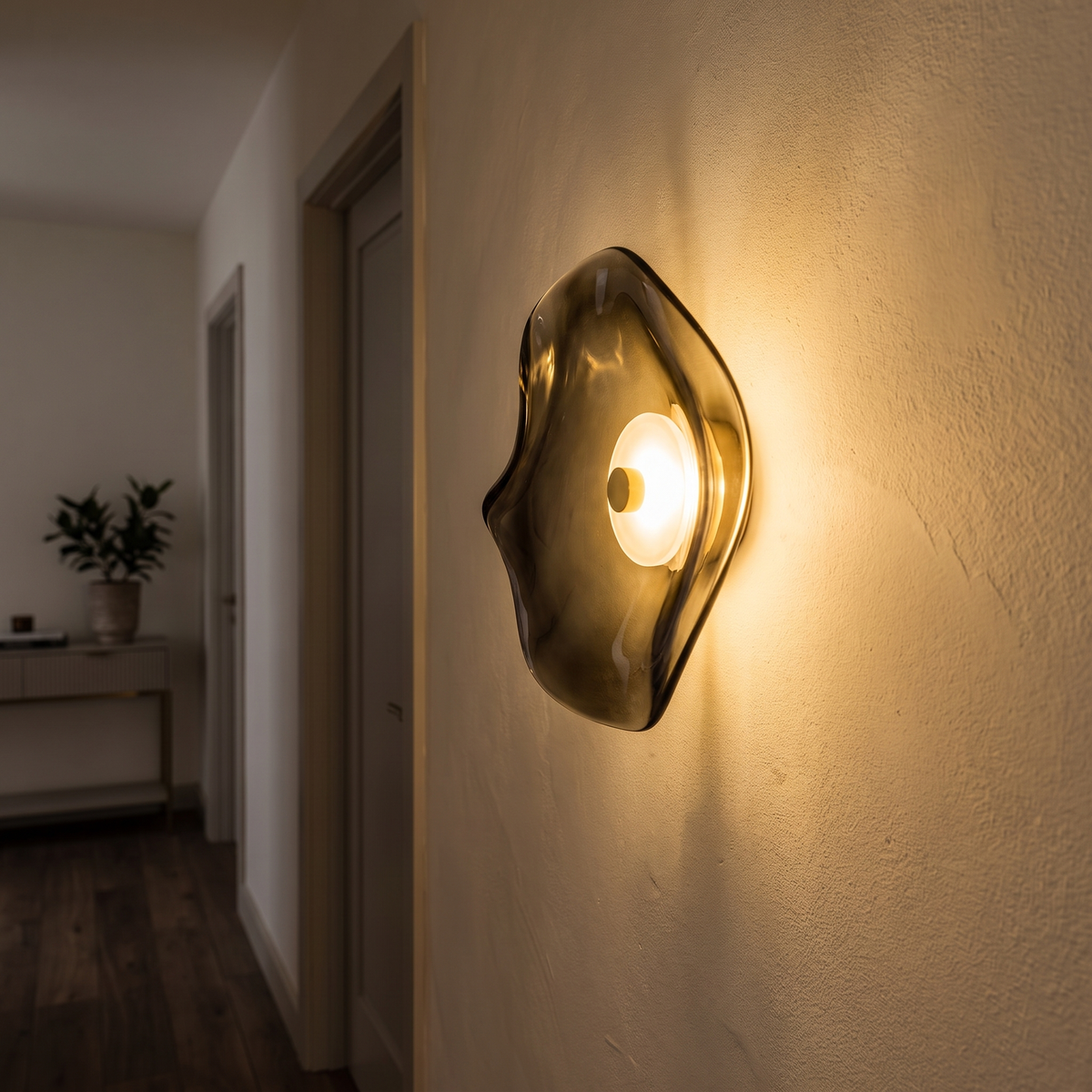 Tinted glass sconce glowing in a hallway