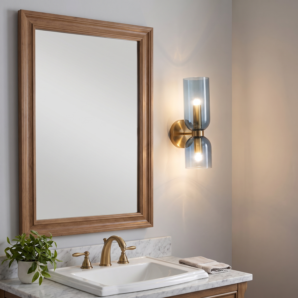 Vanity sconce beside a bathroom mirror