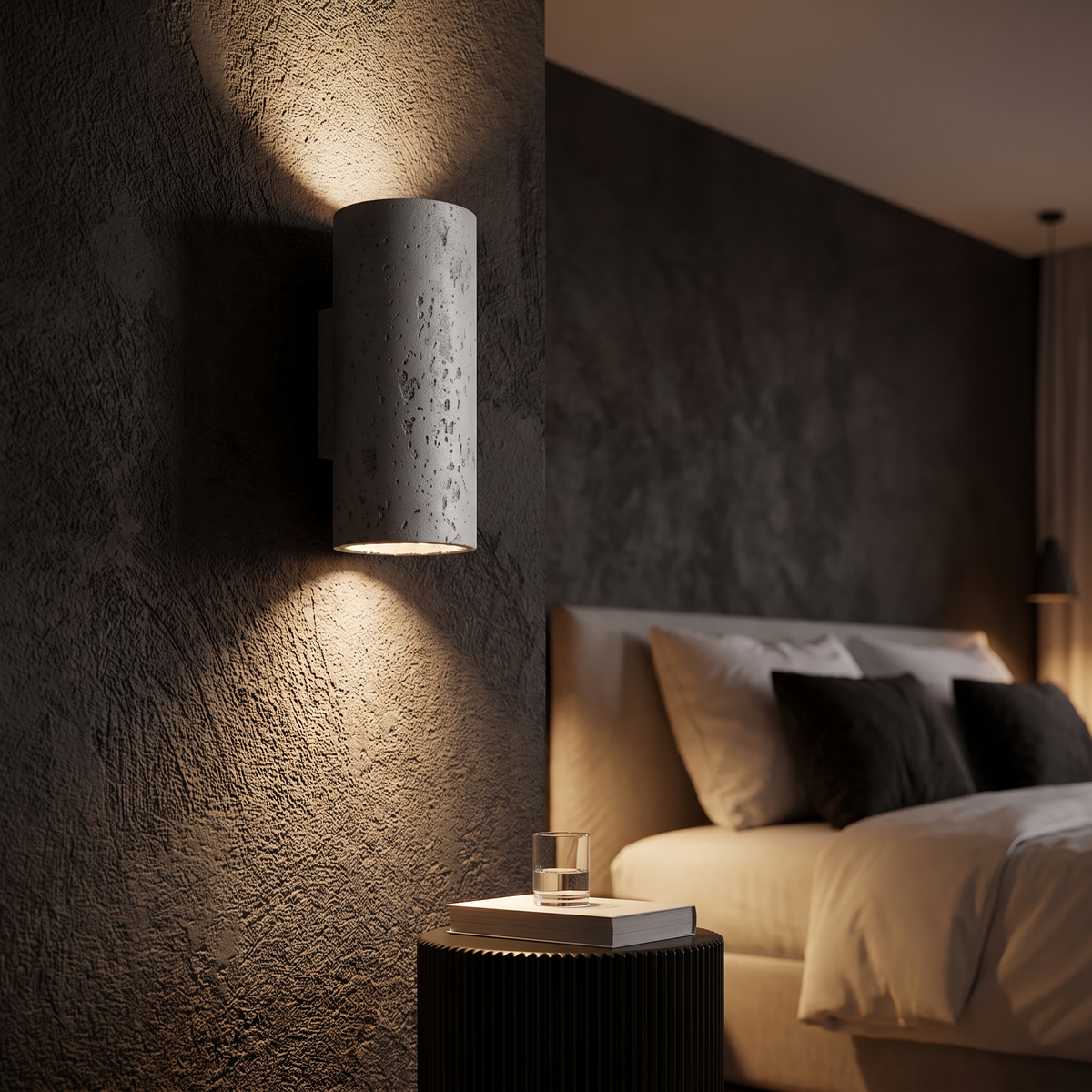 Cylinder sconce casting up and down beams at night