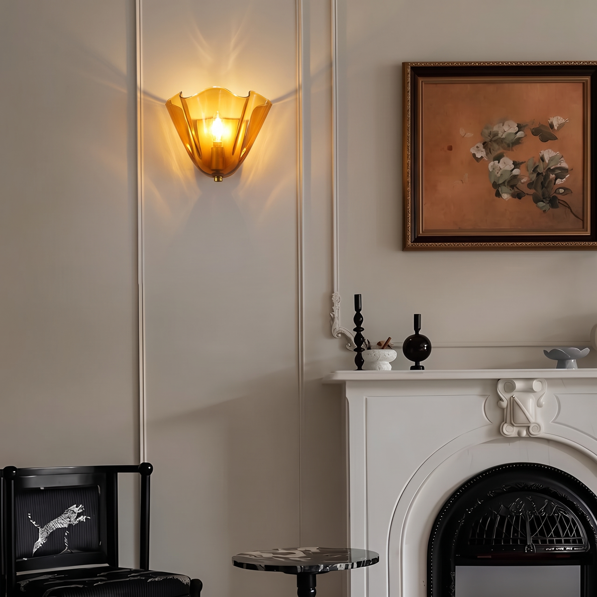 Petal glass sconce glowing in a dining room