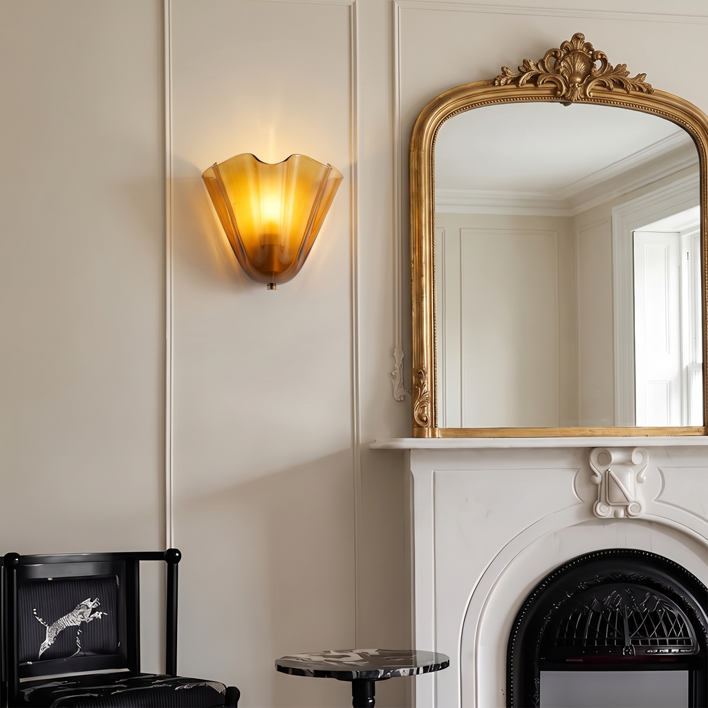 Petal glass sconce beside a mirror