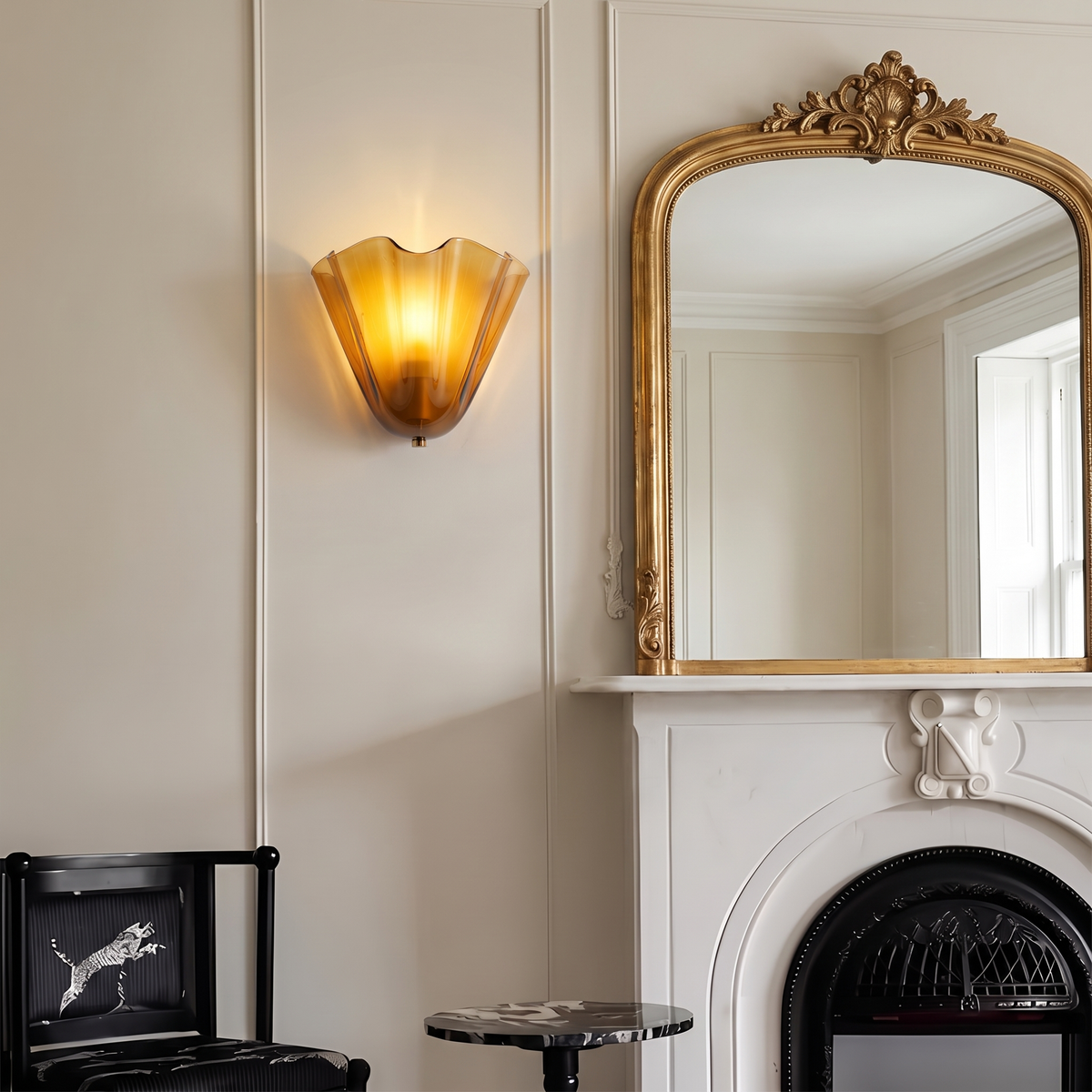Petal glass sconce beside a mirror