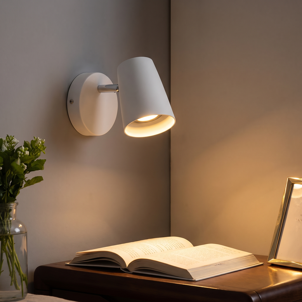 Nordic sconce glowing over a nightstand