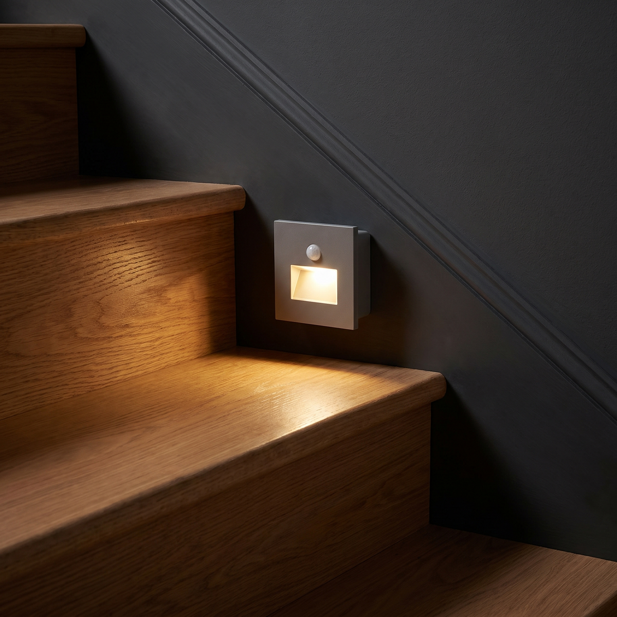 Step light mounted on a staircase wall