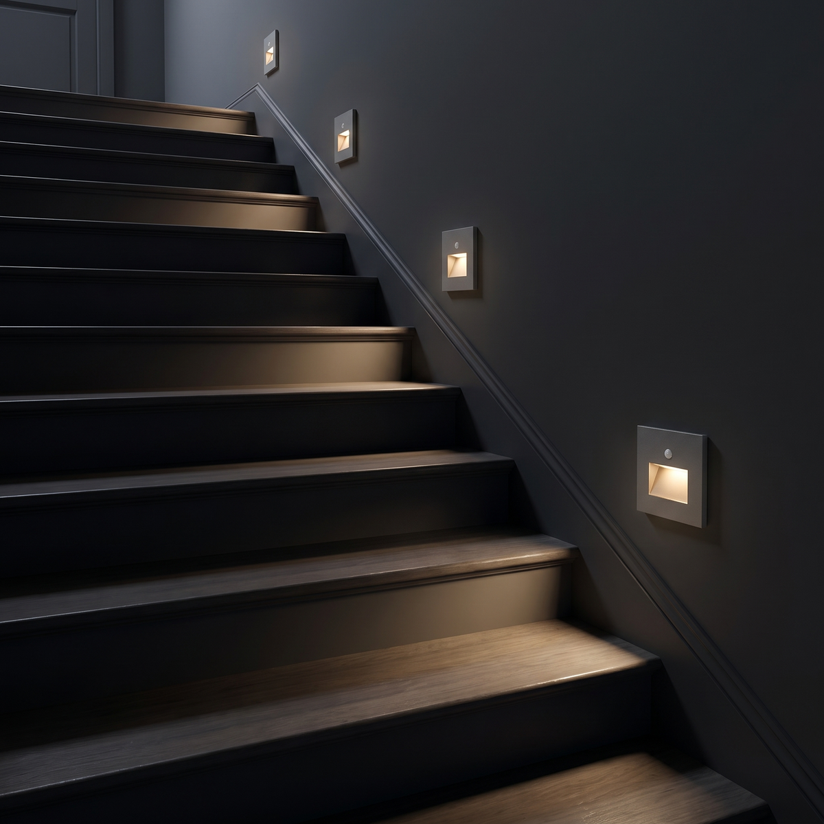 Step lights glowing along a dark staircase