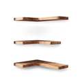 Set of three wooden corner shelves on white background